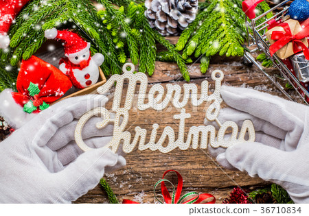 Merry Christmas text on Santa hand Merry Christmas text on Santa hand 36710834