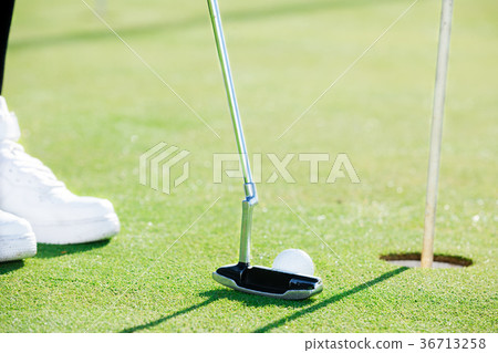 Golfer preparing to hit Golfer preparing to hit 36713258