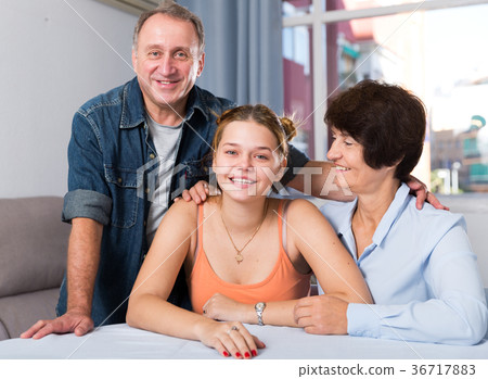 Portrait of happy family at the table Portrait of happy family at the table 36717883