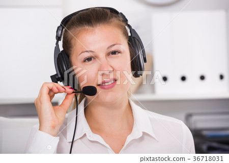 Portrait of operator female which is talking with client 36718031