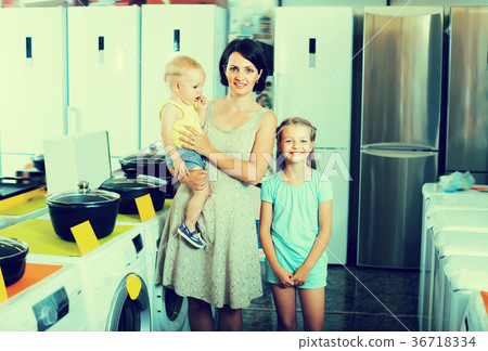 Adult family with two children shopping 36718334