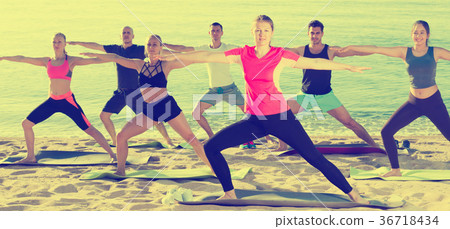 People doing exercises on beach People doing exercises on beach 36718434