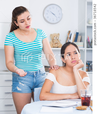 Two teenage girls squabbling at home Two teenage girls squabbling at home 36718542