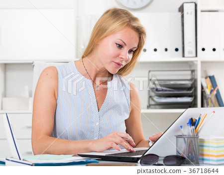 young business woman working on laptop in office young business woman working on laptop in office 36718644