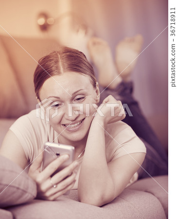 Woman resting with phone 36718911