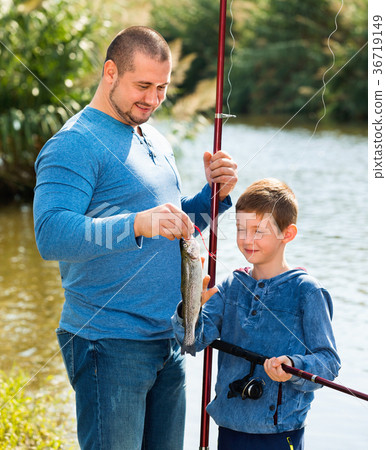 Portrait of father and son fishing with rods Portrait of father and son fishing with rods 36719149