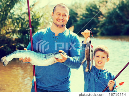 Portrait of father and son fishing with rods 36719354