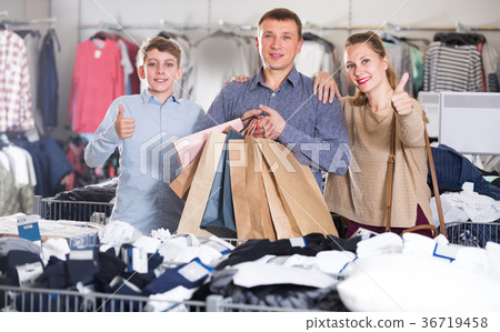 Parents with their son are pleased purchases Parents with their son are pleased purchases 36719458