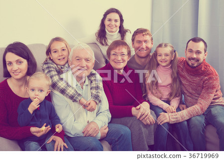 Smiling family making numerous photos 36719969