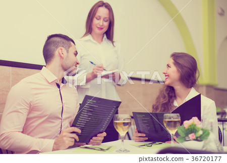 Couple making order in cafe 36720177
