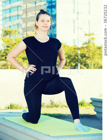 Young female during outdoor training yoga 36720232