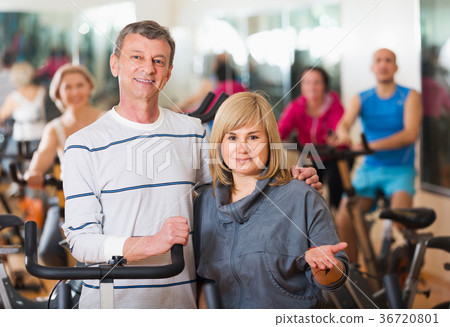 Elderly couple exercising in gym Elderly couple exercising in gym 36720801