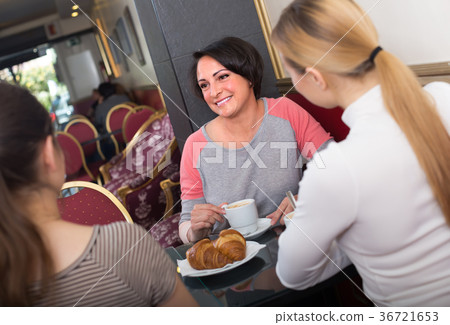 Female friends in the cafeteria. 36721653