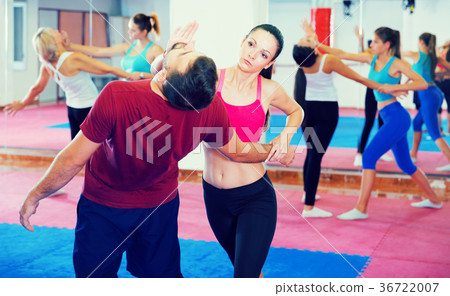 Woman training self-defence moves 36722007