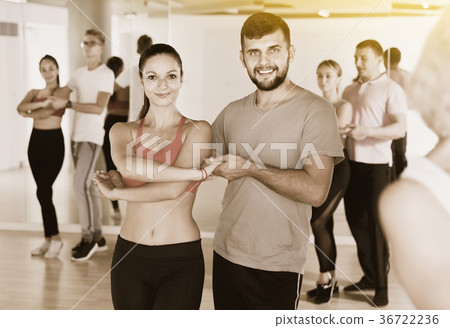 Group of young adults dancing salsa in club 36722236