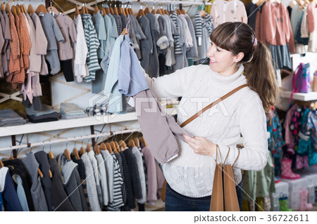 Woman chooses clothes in the store 36722611