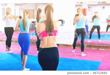 Sporty women are training box in gym. Sporty women are training box in gym. 36722685