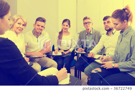 Group of cheerful students at extension courses Group of cheerful students at extension courses 36722749