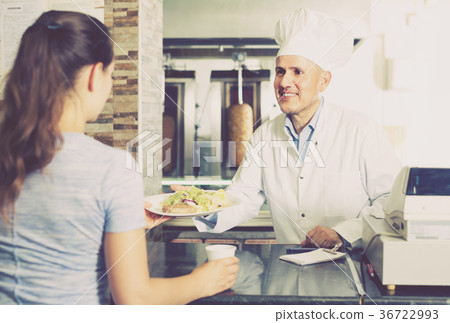 man chef giving order with kebab 36722993