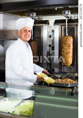 man chef serving fresh kebab 36723079