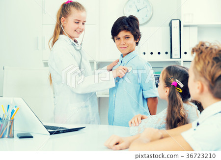 Young doctor in uniform leading medical appointment 36723210