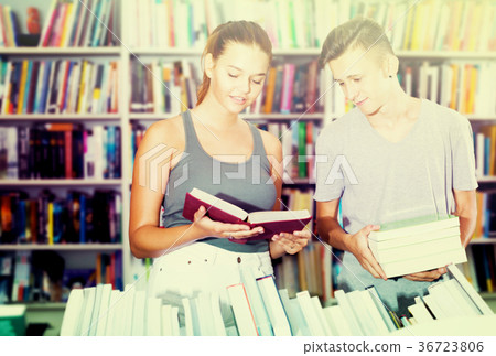 Girl and boy in book store 36723806