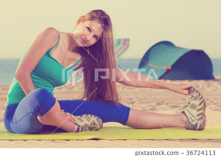 Portrait of sportswoman which is doing excercises on endurance 36724113