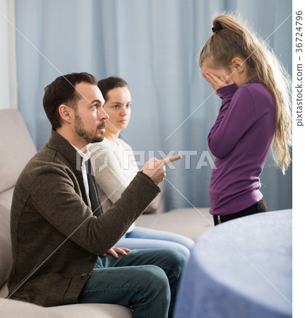 Parents lecturing daughter 36724796