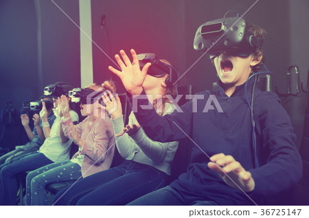 Enthusiastic children in virtual reality glasses in quest room 36725147