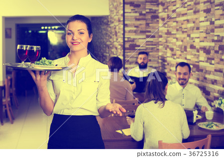 Female waiter showing country restaurant 36725316