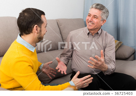 Adult father and son friendly conversation 36725403