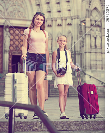 Mother with daughter travelers strolling Mother with daughter travelers strolling 36725873
