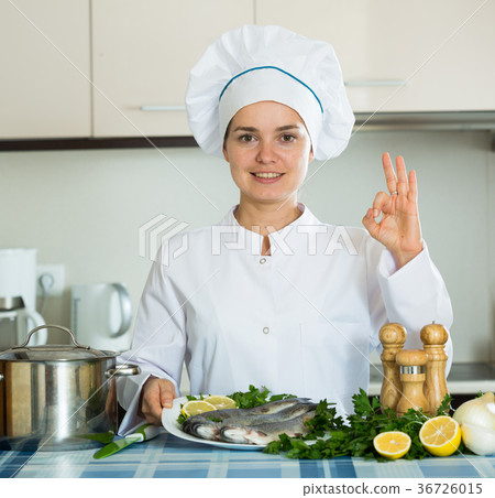 Professional chef cooking fresh trout at kitchen 36726015