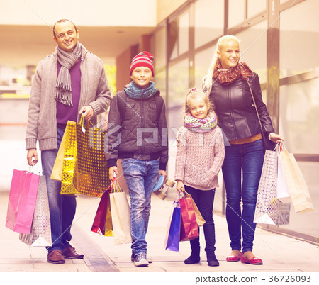 Parents with children shopping in city. Parents with children shopping in city. 36726093