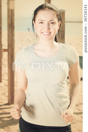 Adult girl running on beach Adult girl running on beach 36726141