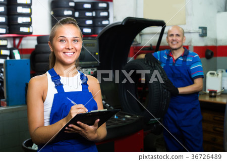 girl in workwear in auto mechanic workshop. 36726489