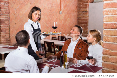 Female waiter bringing order to visitors 36726596
