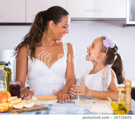 Woman and child cooking strudel 36726605