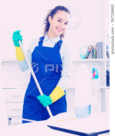 Woman with supplies cleaning in office 36726660