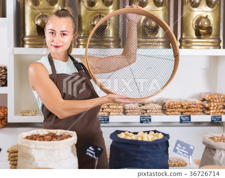 Portrait of girl seller who is standing with ring for grind 36726714