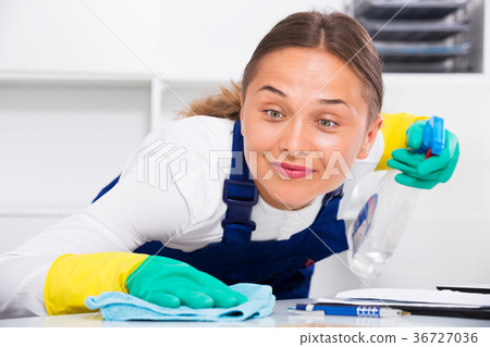 Woman cleaning at company office Woman cleaning at company office 36727036