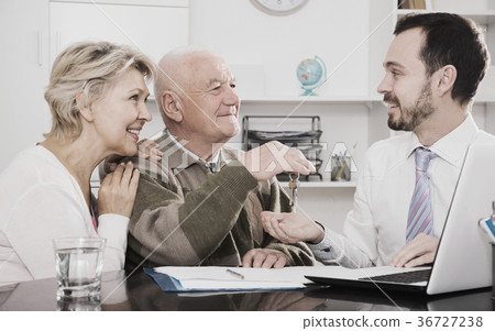 Couple selling house in bank 36727238