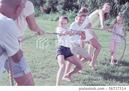 cheerful kids with parents playing active games cheerful kids with parents playing active games 36727314