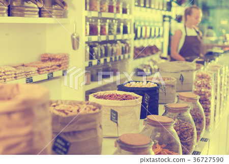 Image of showcase with dried fruits and nuts in container 36727590
