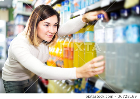 female shopper searching for beverages female shopper searching for beverages 36728169