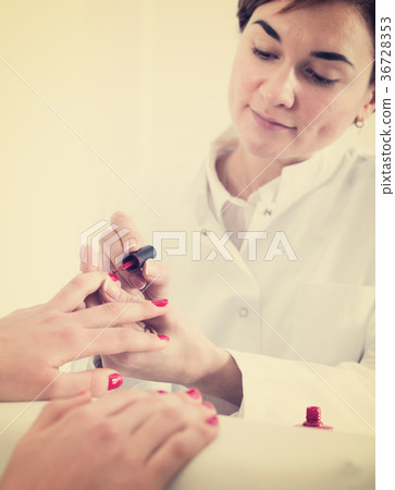 Woman doing manicure Woman doing manicure 36728353