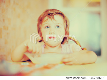 child himself eats from plate with spoon child himself eats from plate with spoon 36728615