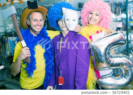 Wife and husband are posing with mannequin 36729401