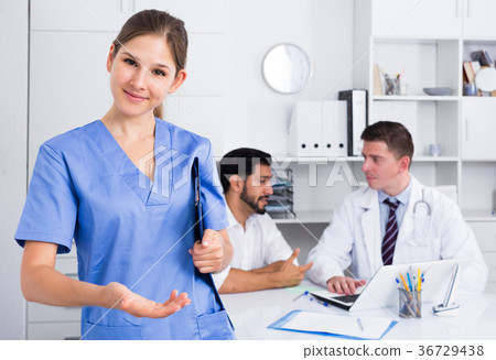 Female doctor welcoming to clinic 36729438