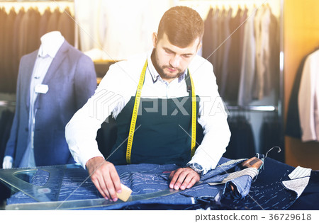 Male tailor working at workshop 36729618
